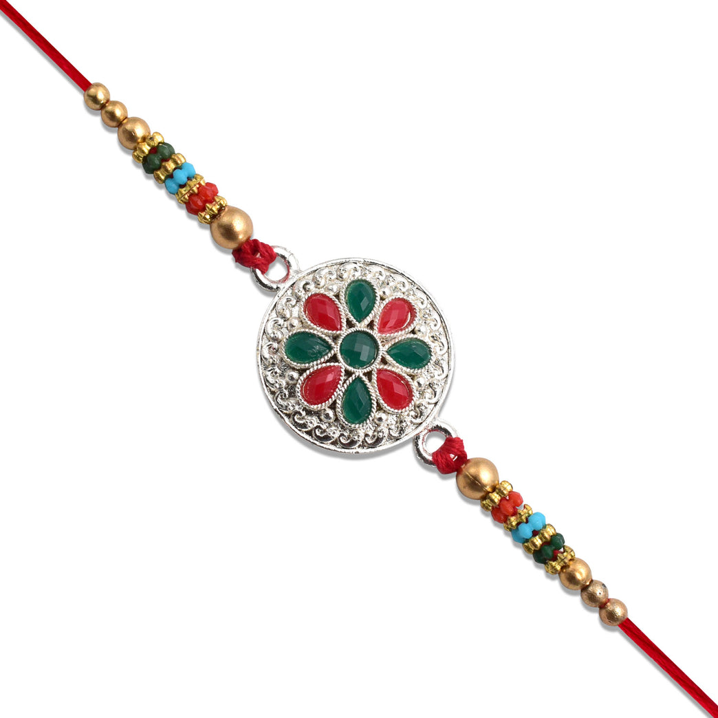 Silver Plated Floral Rakhi With Red Green Stones