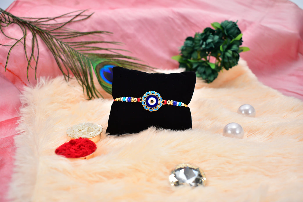 Evil Eye Rakhi With Blue Beads And Golden Accents Protective Nazar Design
