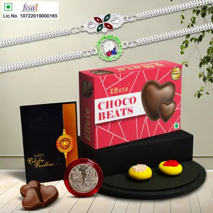 Rakhi Gift Combo With 2 Stylish Rakhis For Brother Includes Choco Beats Box Silver Coin Roli Chawal Greeting Card