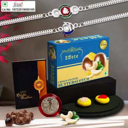 Rakhi Gift Combo With 2 Elegant Rakhis For Brother  Includes Choco Coated Butterscotch Box Silver Coin Roli Chawal  Greeting Card